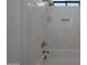 Bright bathtub with white tiled walls, and gold shower fixtures at 2859 E Los Altos Rd, Gilbert, AZ 85297