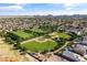 Overhead view of a community park with baseball fields, green space, and residential homes nearby at 36130 N Quiros Dr, Queen Creek, AZ 85143