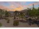 Backyard aerial view featuring desert landscaping, a fountain, a patio, and outdoor dining, ideal for outdoor living at 36130 N Quiros Dr, Queen Creek, AZ 85143