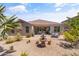 Backyard featuring a fountain, patio, and landscaping at 36130 N Quiros Dr, Queen Creek, AZ 85143