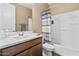 Bathroom featuring a shower with curtain and dark-wood vanity at 36130 N Quiros Dr, Queen Creek, AZ 85143