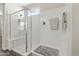 Bathroom featuring an enclosed glass shower and towel rack at 36130 N Quiros Dr, Queen Creek, AZ 85143