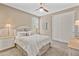 Bedroom featuring soft lighting, a ceiling fan, and closet at 36130 N Quiros Dr, Queen Creek, AZ 85143