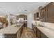 Modern kitchen with granite countertops, stainless steel appliances, a central island, and stylish cabinets at 36130 N Quiros Dr, Queen Creek, AZ 85143