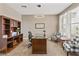 Home office boasting dark-wood furniture and decorative accents at 36130 N Quiros Dr, Queen Creek, AZ 85143