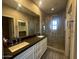 Luxurious bathroom with double sinks, granite countertop, walk-in shower, and neutral color palette at 3935 E Rough Rider Rd # 1282, Phoenix, AZ 85050