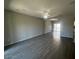 Spacious open-concept living room with neutral paint, ceiling fan, recessed lighting, and modern tile flooring at 3935 E Rough Rider Rd # 1282, Phoenix, AZ 85050