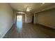 Spacious open-concept living room with neutral paint, ceiling fan, recessed lighting, and modern tile flooring at 3935 E Rough Rider Rd # 1282, Phoenix, AZ 85050