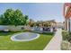 View of large trampoline and backyard entertaining area with outdoor kitchen at 3955 E Fox Cir, Mesa, AZ 85205