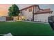 Lush backyard with green lawn, perfect for outdoor activities and relaxation at 3955 E Fox Cir, Mesa, AZ 85205