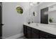 Bathroom featuring a vanity with dark cabinets, a round window and stylish decor at 3955 E Fox Cir, Mesa, AZ 85205