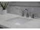Elegant bathroom vanity with a marble countertop, sleek silver faucet, and a decorative succulent, adding charm at 3955 E Fox Cir, Mesa, AZ 85205
