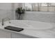 Modern bathroom features a luxurious white soaking tub and elegant marble surround at 3955 E Fox Cir, Mesa, AZ 85205