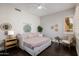 Cozy bedroom featuring a trundle daybed, stylish decor, and natural light at 3955 E Fox Cir, Mesa, AZ 85205