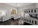' room with bunkbeds, white dresser and hardwood floors, and a large window providing natural light at 3955 E Fox Cir, Mesa, AZ 85205