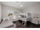 A cheerful bedroom with bunkbeds, hardwood floors, and a window offering natural light at 3955 E Fox Cir, Mesa, AZ 85205