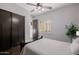 Comfortable bedroom featuring a wood bed frame, closet, and natural light at 3955 E Fox Cir, Mesa, AZ 85205