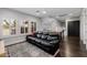 Open bonus room featuring hardwood floors, plantation shutters, and stairs to another level at 3955 E Fox Cir, Mesa, AZ 85205