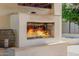 Cozy outdoor fireplace with a mantel, perfect for creating a relaxing atmosphere in the backyard at 3955 E Fox Cir, Mesa, AZ 85205