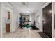 Home gym featuring neutral paint, ceiling fan, wood-look floors and ample workout equipment at 3955 E Fox Cir, Mesa, AZ 85205