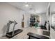 Well-lit home gym with wood floors and a variety of workout equipment at 3955 E Fox Cir, Mesa, AZ 85205