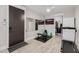 Workout area featuring sleek floors, wall mounted mirror and a large picture window at 3955 E Fox Cir, Mesa, AZ 85205