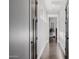 Bright hallway featuring hardwood floors, white walls, and dark wood trim at 3955 E Fox Cir, Mesa, AZ 85205