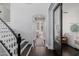 Inviting hallway with hardwood floors leads to an arched entryway and a bedroom at 3955 E Fox Cir, Mesa, AZ 85205