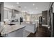 Open-concept kitchen featuring dual islands, granite countertops, and stainless steel appliances at 3955 E Fox Cir, Mesa, AZ 85205