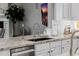 Kitchen sink with granite countertops, stainless steel appliances, and a view of the living area at 3955 E Fox Cir, Mesa, AZ 85205
