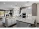Bright kitchen with white cabinets, granite countertops, double islands, and stainless steel appliances at 3955 E Fox Cir, Mesa, AZ 85205