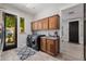 Spacious laundry room featuring modern washer/dryer and ample cabinet storage at 3955 E Fox Cir, Mesa, AZ 85205