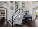 Staircase and piano in an open-concept living space with soaring ceilings and natural light at 3955 E Fox Cir, Mesa, AZ 85205