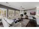 Cozy living room with plush seating, a fireplace, and large windows, perfect for relaxation at 3955 E Fox Cir, Mesa, AZ 85205