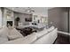 Spacious living room with hardwood floors, a fireplace, and an open floor plan connecting to the kitchen at 3955 E Fox Cir, Mesa, AZ 85205