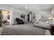 Relaxing main bedroom with a massage chair, balcony access, and a neutral color palette for ultimate comfort at 3955 E Fox Cir, Mesa, AZ 85205