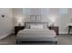 Cozy main bedroom featuring soft bedding, decorative wall art, and bedside lamps for a warm, inviting ambiance at 3955 E Fox Cir, Mesa, AZ 85205