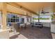 Expansive covered patio with outdoor kitchen, dining and seating areas at 3955 E Fox Cir, Mesa, AZ 85205