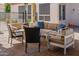 Comfortable outdoor seating area with plush cushions, offering a relaxing space on the brick patio at 3955 E Fox Cir, Mesa, AZ 85205