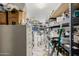 Walk-in pantry with metal storage racks and shelving units, ideal for organization at 3955 E Fox Cir, Mesa, AZ 85205