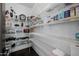 Spacious walk-in pantry with ample wire shelving, providing an abundance of storage for all your kitchen essentials at 3955 E Fox Cir, Mesa, AZ 85205