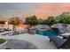 Resort-style pool and spa with rock features, fire pit, and lounge chairs for ultimate relaxation at 3955 E Fox Cir, Mesa, AZ 85205