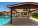 Poolside view of the home exterior under the covered patio at 4134 W Camino Acequia --, Phoenix, AZ 85051