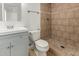 Updated bathroom featuring a walk-in shower, tiled floors, and modern fixtures at 4134 W Camino Acequia --, Phoenix, AZ 85051