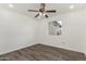 Comfortable bedroom with ceiling fan, wood-look floors, and natural light at 4134 W Camino Acequia --, Phoenix, AZ 85051