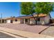 Charming single-story home featuring a low maintenance yard and solar panels at 4134 W Camino Acequia --, Phoenix, AZ 85051