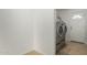 Laundry room area features a washing machine and dryer with access to the backyard at 4134 W Camino Acequia --, Phoenix, AZ 85051
