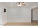 Spacious living area with tile flooring and a modern ceiling fan at 4134 W Camino Acequia --, Phoenix, AZ 85051