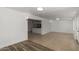 Spacious living area with tile floors, featuring a pass-through to the adjacent kitchen at 4134 W Camino Acequia --, Phoenix, AZ 85051