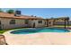 A backyard pool with a covered patio is perfect for outdoor relaxation and entertaining at 4134 W Camino Acequia --, Phoenix, AZ 85051